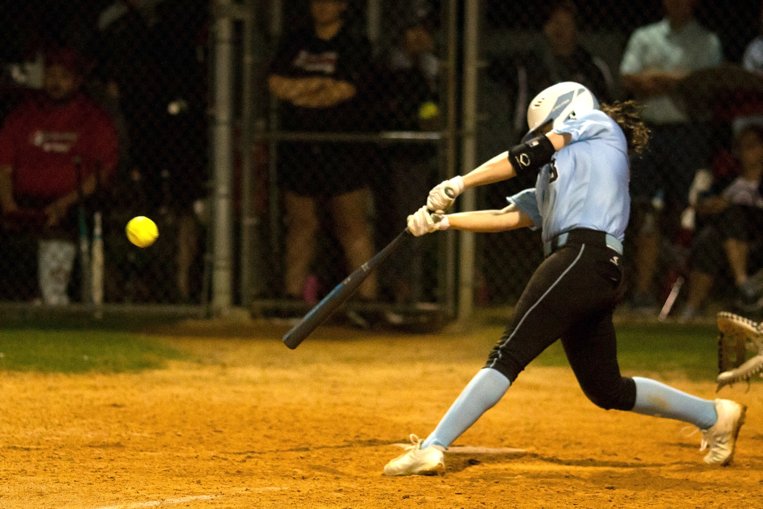 Michelle Leone delivers a base hit to drive in the Sharks only run